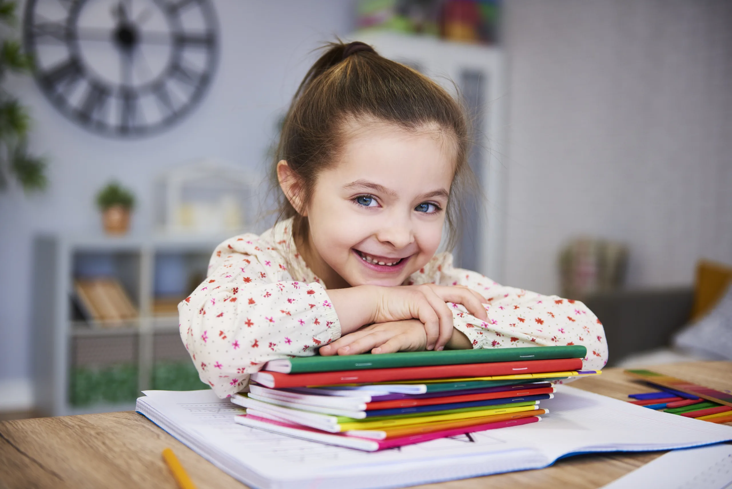 Smiling girl studying at home Smiling girl studying at home